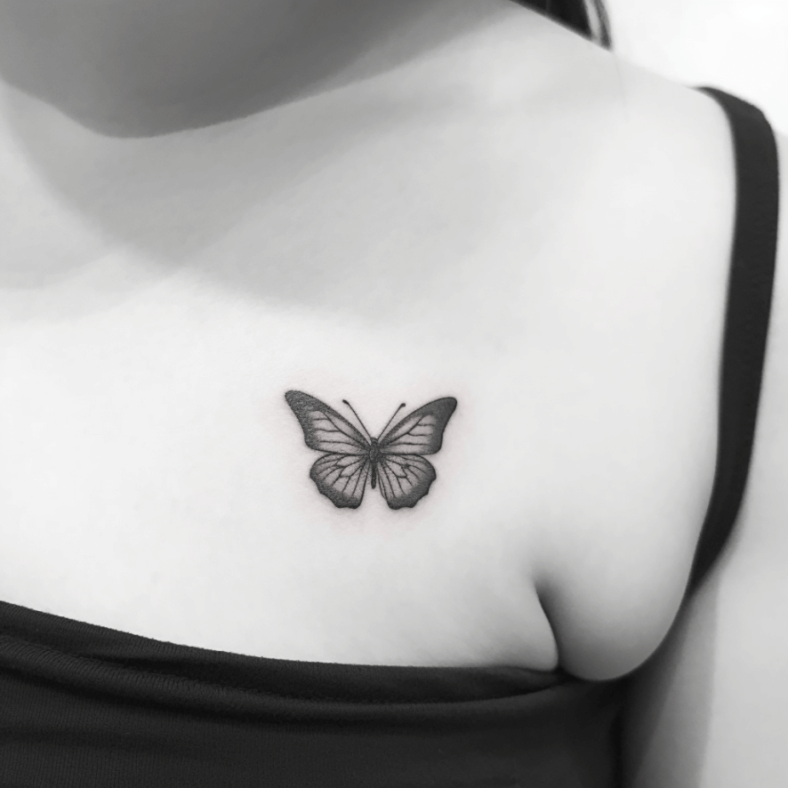 minimalist butterfly outline tattoo